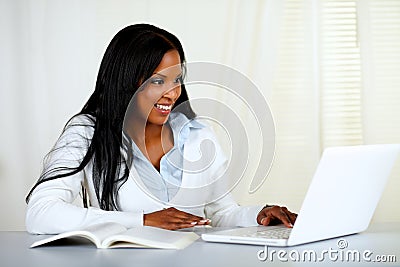 American young black woman working on laptop Stock Photo