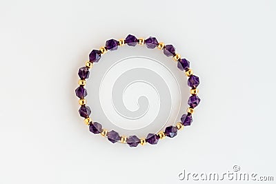 Amethyst Bracelet with Polygonal Beads and Round Gold Beads Isolated on White Stock Photo