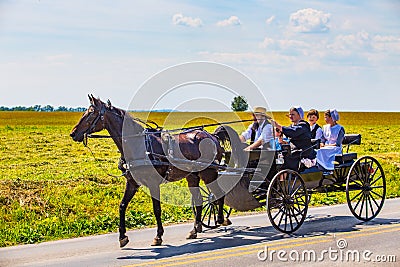 Amish Family in Black Wagon Editorial Stock Photo