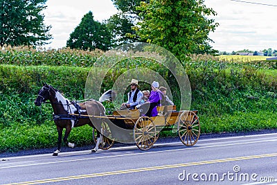 Amish Family in Wagon Editorial Stock Photo