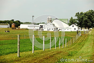 An Amish farm with pasture, barn silo and windmill. Stock Photo