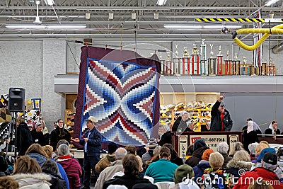 Amish Volunteers Help at the Annual Quilt Auction Editorial Stock Photo