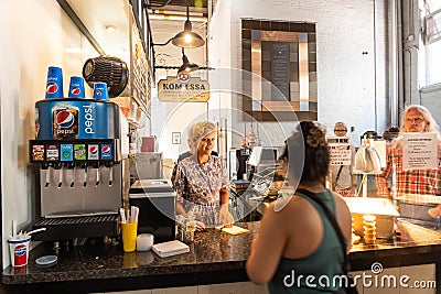 Amish woman selling food in Lancaster Central Market Editorial Stock Photo