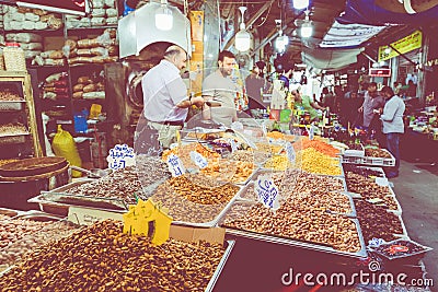 AMMAN, JORDAN - MAY 18, 2019: Spices, nuts and sweets shop on the market in Amman downtown, Jordan. Choice of Arabic spices on the Editorial Stock Photo