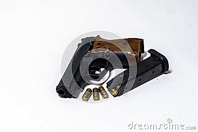 Ammunition cartridges on white background, the pistol with cartridges on a light background Stock Photo