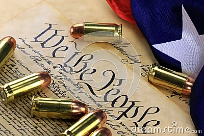 Ammunition and flag on US Constitution - History of the Second Amendment Stock Photo