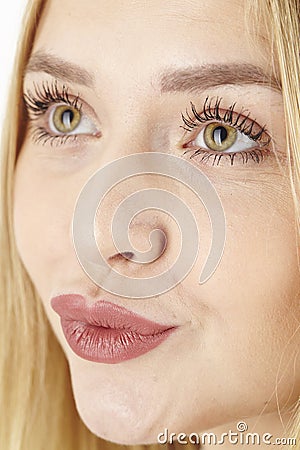 Amorous attractive blond woman purses her lips Stock Photo