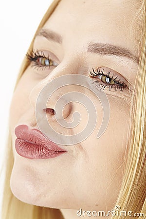 Amorous attractive blond woman purses her lips Stock Photo