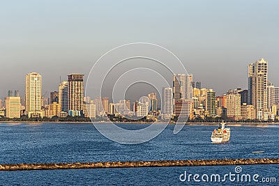 Amosup rescue ship and Malate Bayview Mansions off South Harbor, Manila, Philippines Editorial Stock Photo