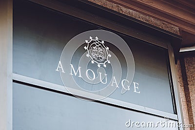 Amouage brend sign on city street. Signboard logo of international luxury fragrance brand Amouage store, shop, mall, boutique. Editorial Stock Photo