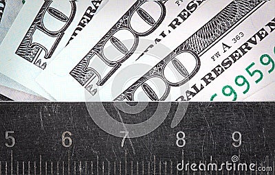 Amount of money measured a ruler Stock Photo