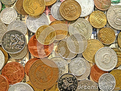 Amount of old money coins of different countries on dollar background Stock Photo