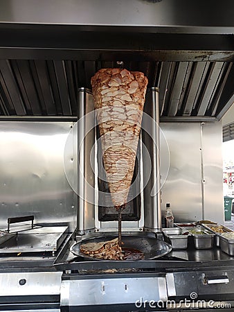 Kebab or shawarma is sold by hawkers in small roadside shops as a takeaway dish. Editorial Stock Photo