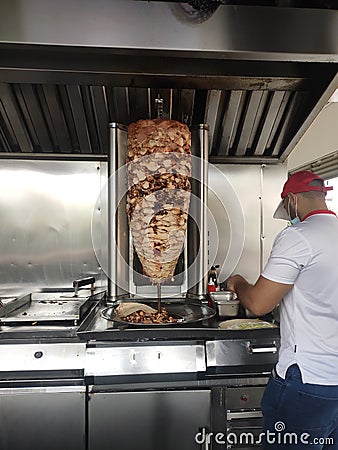 Kebab or shawarma is sold by hawkers in small roadside shops as a takeaway dish. Editorial Stock Photo