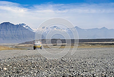 Amphibian Vehicle at a landscape with beautiful mountains and a blue sky Stock Photo