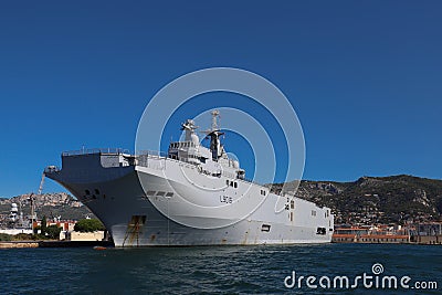 The amphibious assault helicopter carrier Dixmude docked in the French Navy base at the harbor of Toulon, France Editorial Stock Photo