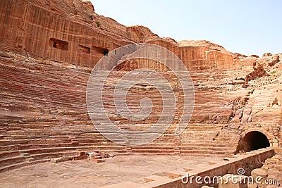 Amphitheatre of the lost ancient city of Petra with seats carved into the rocks, the Rose red City, Jordan Stock Photo