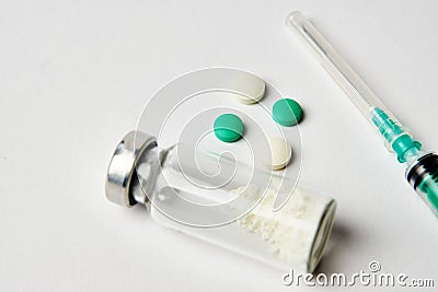 Vial Drug Vaccine Plastic Syringe with Needle and medicine tablet Stock Photo