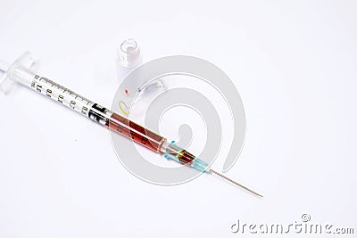 Ampule of drug is opened and liquid drug in in plastic syringe with a medical needle Stock Photo