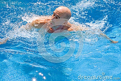 Amputee Swimming Stock Photo