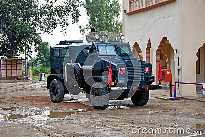 Amritsar, Punjab, India - September 28 2019: Black armored car with a soldier and a machine gun on top Editorial Stock Photo