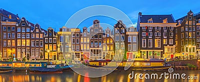 Amstel river, canals and night view of beautiful Amsterdam city. Netherlands. Stock Photo