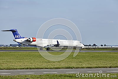 Amsterdam Airport Schiphol - Mitsubishi CRJ-900LR of SAS Cityjet lands Editorial Stock Photo