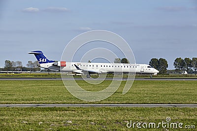 Amsterdam Airport Schiphol - Mitsubishi CRJ-900LR of SAS Cityjet lands Editorial Stock Photo