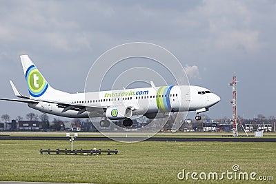 Amsterdam Airport Schiphol - Transavia Sunweb livery Boeing 737 lands Editorial Stock Photo