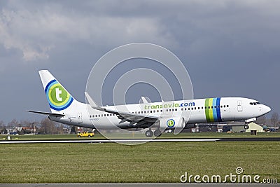 Amsterdam Airport Schiphol - Transavia Sunweb livery Boeing 737 lands Editorial Stock Photo