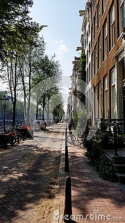 A typical canal-side Amsterdam street Editorial Stock Photo