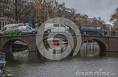 Amsterdam in autumn, traditional buildings along a canal. Editorial Stock Photo