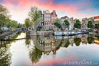 Amsterdam Canal houses at sunset reflections, Netherlands Editorial Stock Photo