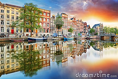 Amsterdam Canal houses at sunset reflections, Netherlands, panorama Stock Photo