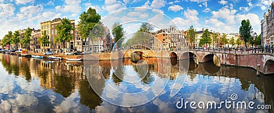 Amsterdam Canal houses vibrant reflections, Netherlands, panora Stock Photo