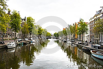 Amsterdam canal moored boats Editorial Stock Photo