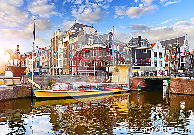 Amsterdam canal Netherlands. Traditional houses and bridge Stock Photo