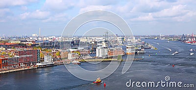 Amsterdam cityscape. Panoramic distance view of industrial area port area and Amstel river waterway. Netherlands Stock Photo