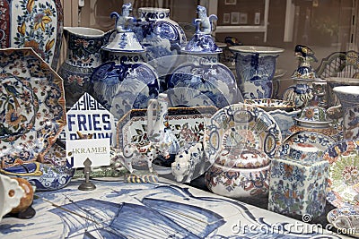 Showcases of Dutch shops with blue typical dishes and skulls Editorial Stock Photo