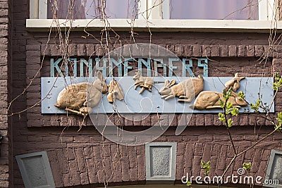 A sign of the kindergarten. Rabbits skip one after another. Editorial Stock Photo