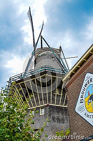 Amsterdam, Holland, August 2019. The Brouwerij`t IJ brewery is housed in a mill that retains all its original charm. The Editorial Stock Photo