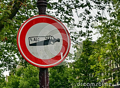 Amsterdam, Holland, August 201. In the central red-light district, a street alcohol prohibition sign. The graphic of the cartel is Editorial Stock Photo