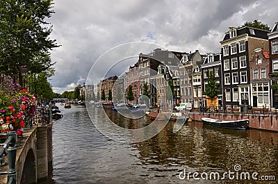 Amsterdam, Holland, August 2019. Classic view on one of the canals of the historic center. The typical houses overlook the water, Editorial Stock Photo