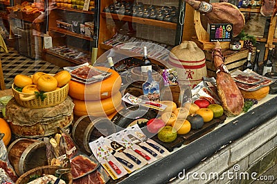 Amsterdam, Holland. August 2019. The showcase of a Dutch delicatessen shop: you can recognize the ham and the typical Dutch cheese Editorial Stock Photo