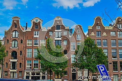 Amsterdam, Holland, August 2019. The typical and charming houses: they are a symbol of the city represented on a postcard. With Editorial Stock Photo