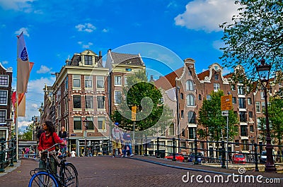 Amsterdam, Holland, August 2019. The typical and charming houses: they are a symbol of the city represented on a postcard. With Editorial Stock Photo