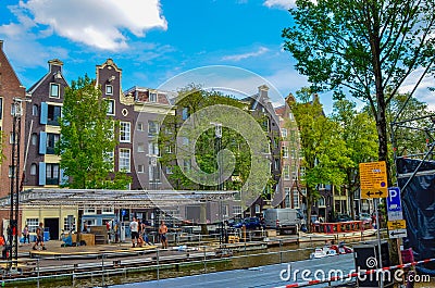 Amsterdam, Holland, August 2019. The typical and charming houses: they are a symbol of the city represented on a postcard. With Editorial Stock Photo