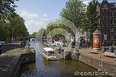 Boat lock on the Korte Prinsengracht and houseboat with flowers Editorial Stock Photo