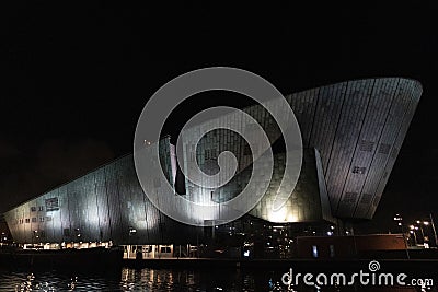 Amsterdam NEMO museum at night canal view Editorial Stock Photo