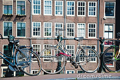 Bicycle on the city street river channel bridge in Amsterdam Editorial Stock Photo